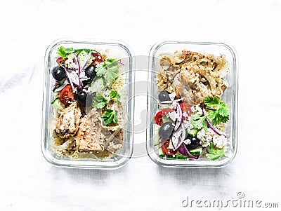 Greek chicken grain lunch box. Lemon herbs chicken, couscous, vegetables, olives, feta cheese lunch box on light background, top Stock Photo