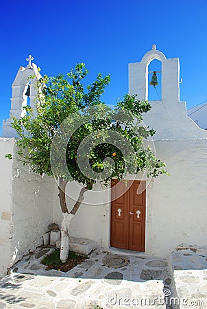 Typical white Greek church. Village square. Stock Photo