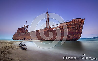 Greek coastline with the famous rusty shipwreck in Glyfada beach near Gytheio, Gythio Laconia Peloponnese. Stock Photo