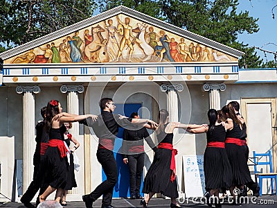 Greek Dancers Against Greek Architecture Editorial Stock Photo