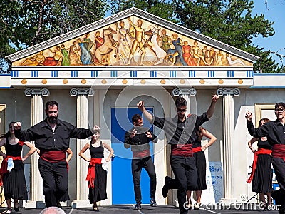 Greek Dancers Against Greek Architecture Editorial Stock Photo