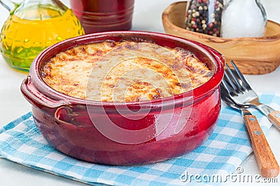 Greek dish moussaka made in traditional ceramic pot, horizontal, closeup Stock Photo