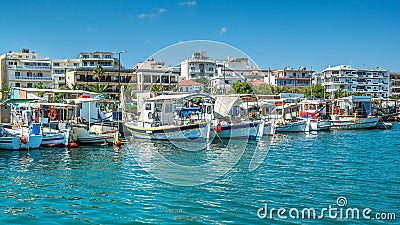 Greek fishing boats in port of Rethymno, Crete island, Greece. View of the port of Rethymno from the sea side with boats and Stock Photo