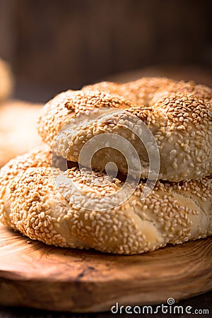 Greek koulouri or Turkish bagels called Simit in stack. Traditional street food, crispy sesame bread ring bagels Stock Photo