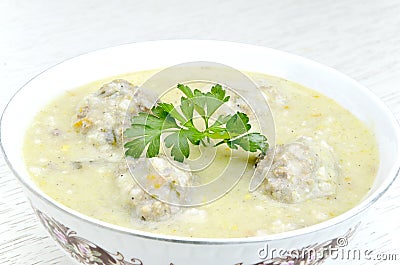 Greek meatball soup in bowl Stock Photo