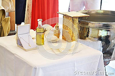 Greek Orthodox christening - baptism oil, gold cross and soap Stock Photo