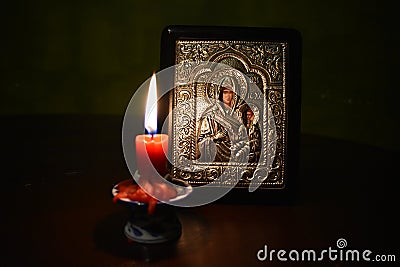 Greek orthodox icon with candle Stock Photo