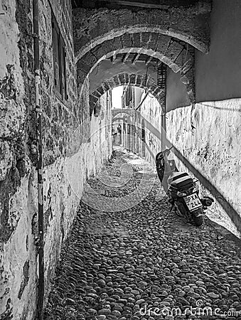 Greek Rhodes old town motorbike scooter alleyway black and white Editorial Stock Photo