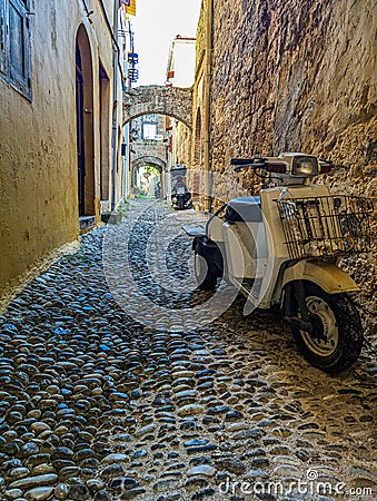 Greek Rhodes old town motorbike scooter alleyway Stock Photo