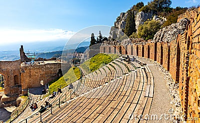 Greek and Roman Teatro antico Ancient Theatre with cavea auditorium in Taormina at Ioanian sea shore of Sicily in Italy Editorial Stock Photo