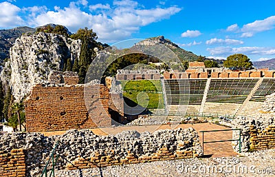 Greek and Roman Teatro antico Theatre with cavea seating auditorium in Taormina at Ioanian sea shore of Sicily in Italy Editorial Stock Photo