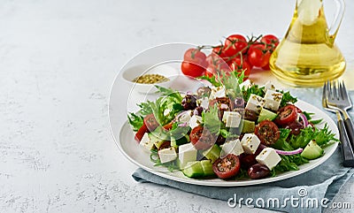 Greek Salad with feta and tomatoes, dieting food on white background copy space closeup Stock Photo