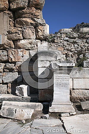 Greek script ancient letters on a rock in Ephesus, Turkey. Stock Photo