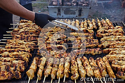 Greek souvlaki.Tasty traditional food from meat of chicken cooking on big barbecue. Stock Photo