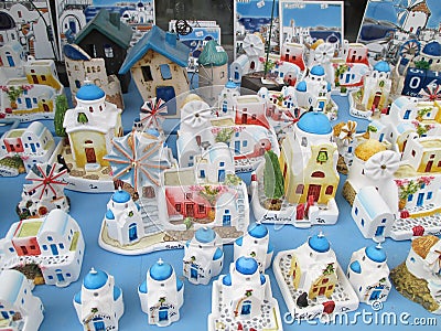 Greek style white and blue churches and houses, souvenirs for sale at Oia village on Santorini island Editorial Stock Photo