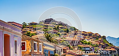 Greek town of Molyvos Mithymna and an impressive fort or castle on top of the hill in the background. Stock Photo