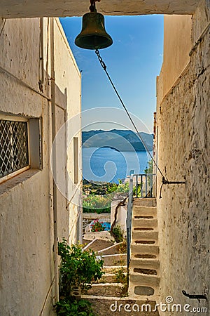 Greek village typical view with whitewashed houses and stairs. Plaka town, Milos island, Greece Stock Photo