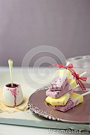 Greek yogurt blueberry and vanilla ice cream popsicles Stock Photo