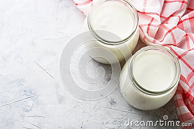 Greek yogurt in glass jars. Stock Photo