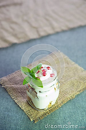 Greek yogurt with granola and pomegranate Stock Photo