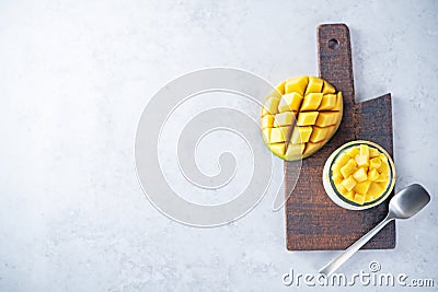 Greek yogurt mango parfait in jars Stock Photo