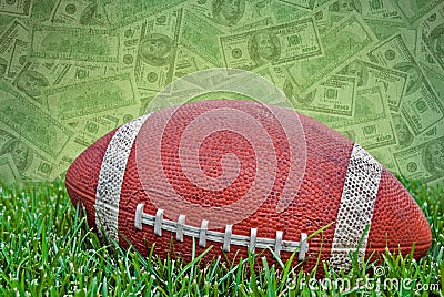 football on grass with money background Stock Photo