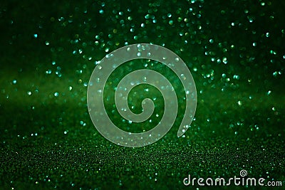 Green abstract glittering background. Defocused lights. Christmas greeting card. Christmas or New Year celebration concept. Copy s Stock Photo