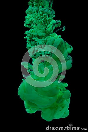 Green acrylic paint in water. Stock Photo