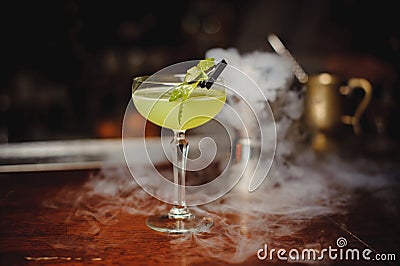 Green alcohol cocktail with lime Stock Photo