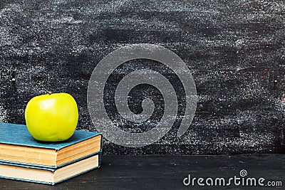 Green apple, book, black board Stock Photo