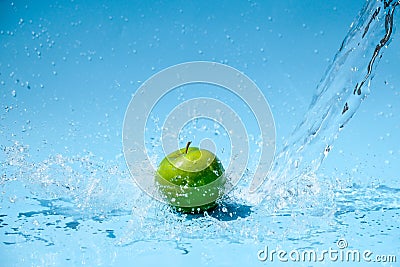 Green apple in clear water splash Stock Photo