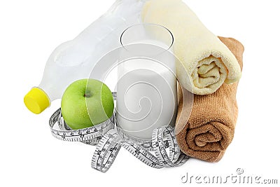Green apple,glass of milk and measuring tape Stock Photo