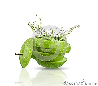 Green apple juice splashing with its fruits Stock Photo