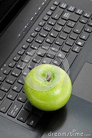 Green apple and laptop Editorial Stock Photo