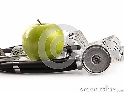 Green apple and measuring tape on white Stock Photo