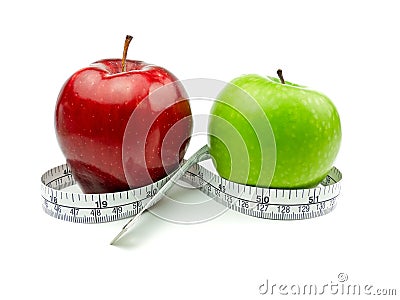 Green Apple and Red Apple with measuring tape Stock Photo