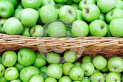 Green apples in the Market. Apples lie in boxes in front of the buyer. Healthy food Stock Photo