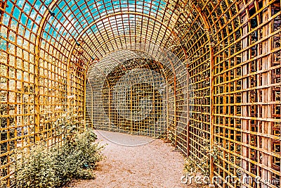 Green archway in a beautiful Versailles garden Editorial Stock Photo