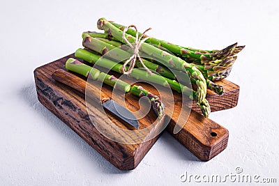 Green asparagus sprout on wooden board Stock Photo