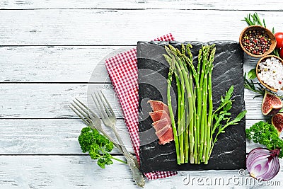 Green asparagus with vegetables. Dishes menu. Free copy space. Stock Photo