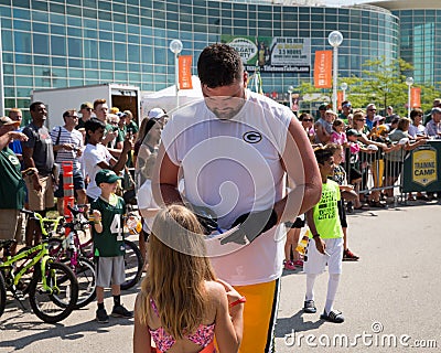 Green Bay Packer Player Signing Autograph for Young Fan Editorial Stock Photo