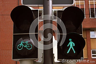 Green bicycle and pedestrian traffic lights Stock Photo