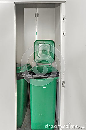 Green bin inside locker Stock Photo