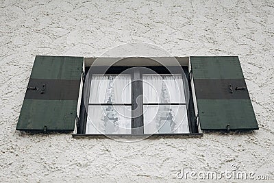 Green and black striped shuttered window of a traditional Bavarian house in Garmisch-Partenkirchen, Germany Stock Photo