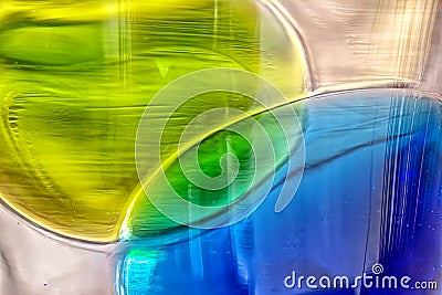 Coloured glass pieces fused into plain glass. Stock Photo