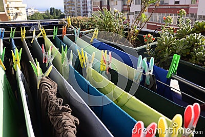 Green and Blue Laundry Drying, Colorful Pins, Home Stock Photo