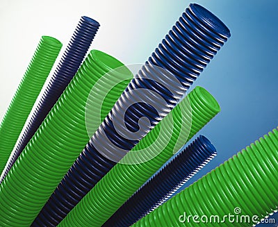 Green and blue plastic tubes Stock Photo