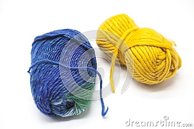 Green blue and yellow ball of wool yarn for knitting close up on a white background Stock Photo