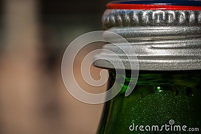 Green bottle and silver cap Stock Photo