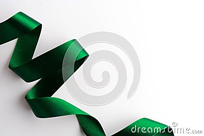 Green bow ribbon satin texture isolated on white Stock Photo